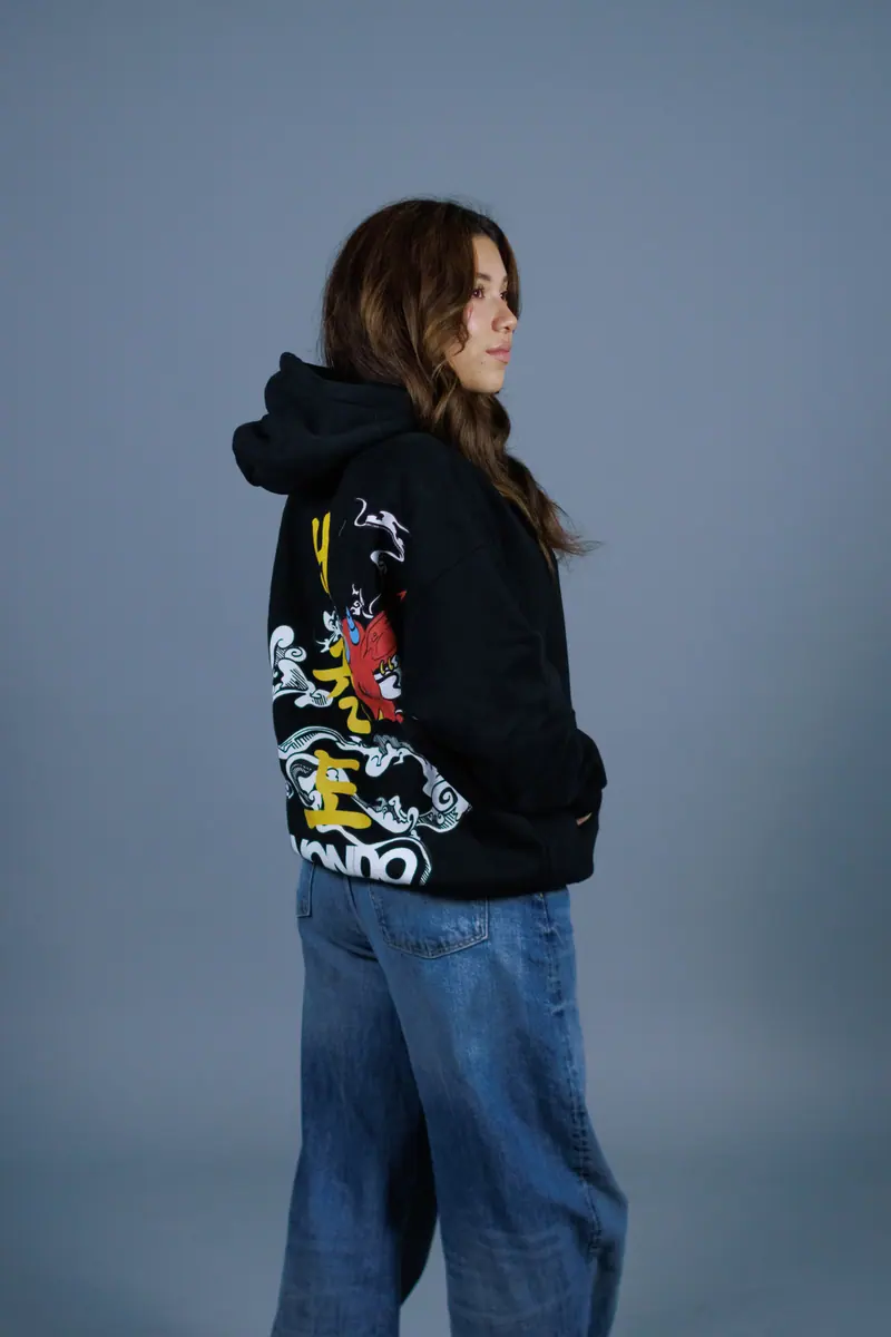 A black hoodie with a large printed design across the back